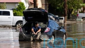 California towns dig out of the mud from first tropical storm in 84 years