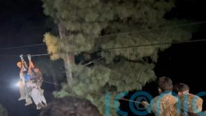 Rescuers save eight people trapped in cable car above canyon in Pakistan