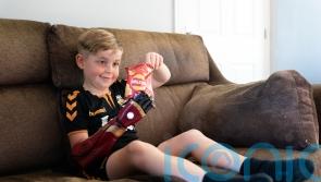 Boy born without a hand gets to grips with new ‘robot arm’