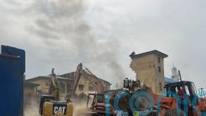 Two dead and many feared trapped as building collapses in Nigeria’s capital