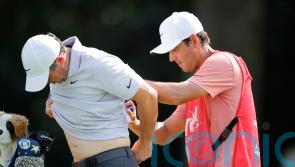 Rory McIlroy three behind lead despite muscle spasms leading into tournament