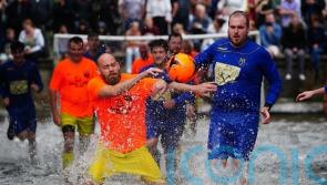 Annual river football match continues to excite crowds in Cotswold village