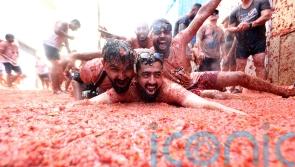 Revellers hurl tomatoes at each other in Spanish town’s Tomatina party