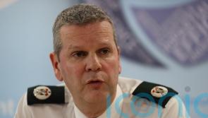 Investigation launched after details of three officers posted on bus shelter