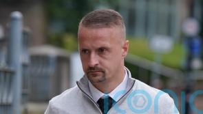 Footballer Leigh Griffiths fined for kicking flare into crowd