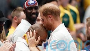 Harry kisses wheelchair rugby player on head at Invictus Games
