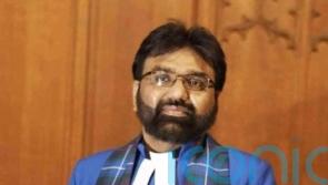 Minister wishes no revenge after bombers killed his mother and 19 relatives