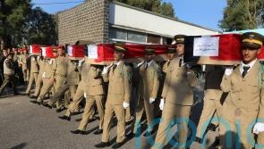 Funerals held in Syria for dozens of victims of attack on military ceremony