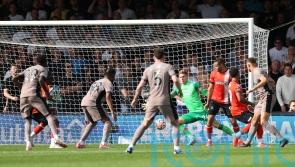 Micky van de Ven scores as 10-man Tottenham go top with win over Luton