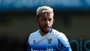 Managerless Gillingham overcome 10-man MK Dons to move third