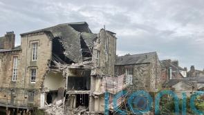 Part of historic Old Courthouse in Cockermouth collapses into river