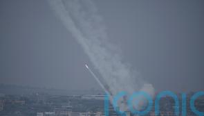 Israel vows complete siege of Gaza amid wave of strikes after incursion by Hamas