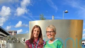 Woman who took on hike two months after brain haemorrhage hands medal to surgeon