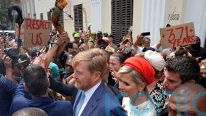 Dutch king and queen confronted by protesters during slavery museum visit