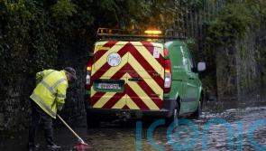 Children carried out of flooded school amid heavy rainfaill in Ireland