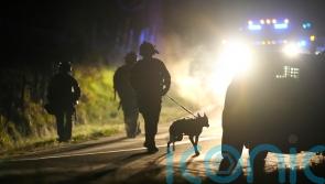 Heavily armed police surround home in search for Maine shooting suspect
