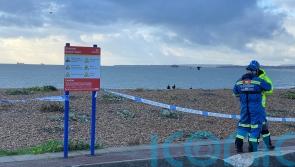 Beach cordoned off after discovery of body