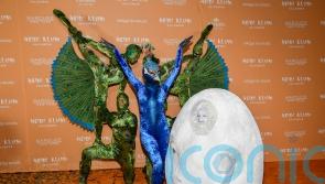 Queen of Halloween Heidi Klum recruits acrobats for peacock costume