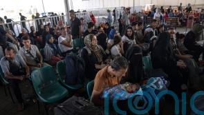 Britons remain trapped in Gaza as hundreds of foreign nationals flee