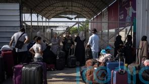 Ministers trying to secure release of more Britons as two aid workers flee Gaza