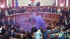 Opposition politicians throw firecrackers and chairs in parliament protest