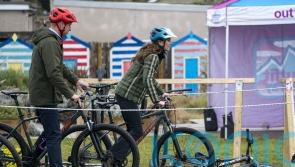 William and Kate cheered on as they show off bike skills