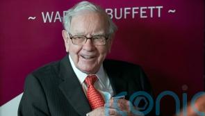 Warren Buffett’s Berkshire Hathaway reports loss as investments fall