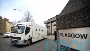 Man to face court after death of 23-year-old in block of flats