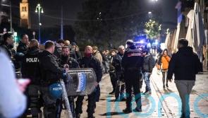 Fan and police officer stabbed in clashes before Champions League match in Milan
