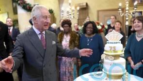 King marks 75th birthday a day early with three-tiered cake at Highgrove