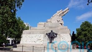 Police say no laws broken as protesters climb on war memorial