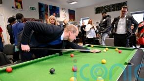 William learns about project tackling youth violence on Moss Side visit