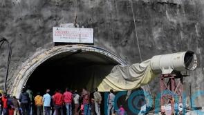 Indian rescuers begin drilling to reach 40 people trapped in collapsed tunnel