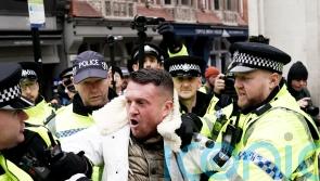 Tommy Robinson escorted from march against antisemitism as man arrested