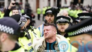 Tommy Robinson sprayed by police during arrest at march against antisemitism