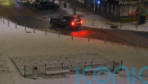 Police appeal for help after woman seen being carried into car