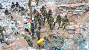 Hopes raised for survivors after more than 30 buried by landslide at Zambia mine