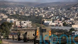 Six Palestinians killed in Israeli military raid on refugee camp, officials say