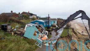 Demolition of five homes on erosion-hit coastline begins