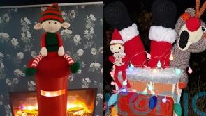 Crocheted ‘cheeky’ elves and Santa in a chimney adorn postboxes