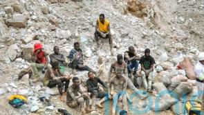 Rescuers recover bodies of 11 miners trapped by landslides after heavy rain