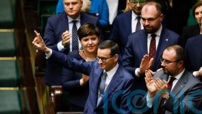 Poland’s outgoing government loses confidence vote