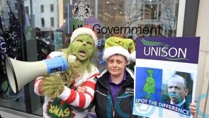 Health workers in Northern Ireland stage Grinch protest in pay dispute