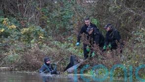 Police divers remove large black bag from river during hunt for Gaynor Lord