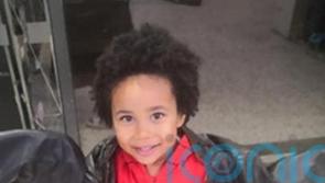 Mother accused of killing her four-year-old son sobs in court