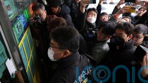 South Korea police raid home of suspect who stabbed opposition leader in neck