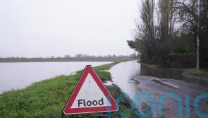 Sewage spills on to public path as treatment works overwhelmed by flood water