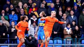 Ipswich beat 10-man AFC Wimbledon to book their place in the FA Cup fourth round