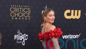 Margot Robbie and Dua Lipa lead the stars in red gowns at the Critics Choice Awards