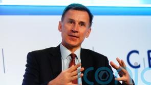 Hunt to tell Davos summit: Britain is on the up and open for business